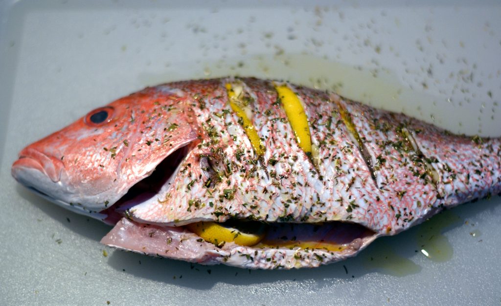 Grilled whole red snapper with lemon